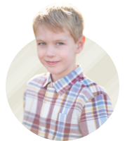 Patient ambassador Ashton, a young boy in a plaid shirt